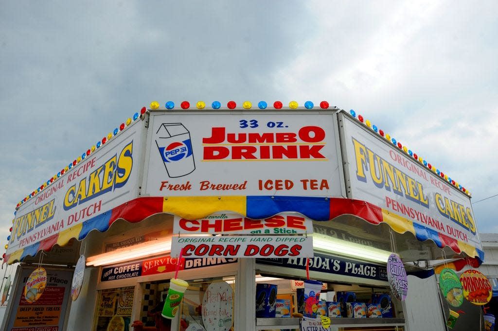 A food vendor at a previous Monroe County Fair is shown in this Monroe News File Photo. Food has always played a huge role in the beloved fair, however there are some fair foods you can make in your very own kitchen all year long.