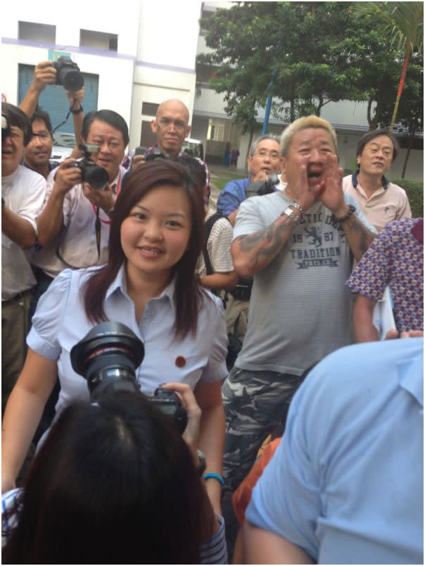 Punggol East by-election winner Lee Li Lian arrives for Workers' Party's parade. Supporters are all smiles.