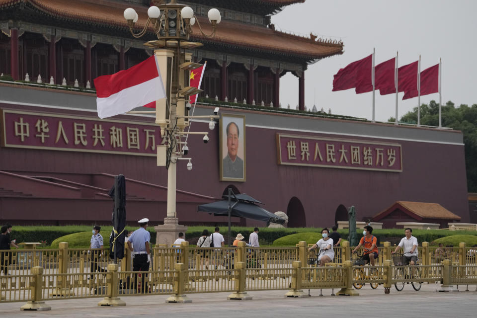 The Indonesian and Chinese national flags are flown together near Mao Zedong's portrait on Tiananmen Gate in Beijing, Monday, July 25, 2022. Indonesian President Joko Widodo was heading to Beijing on Monday for a rare visit by a foreign leader under China's strict COVID-19 protocols and ahead of what could be the first overseas trip by Chinese President Xi Jinping since the start of the pandemic more than two years ago. (AP Photo/Ng Han Guan)