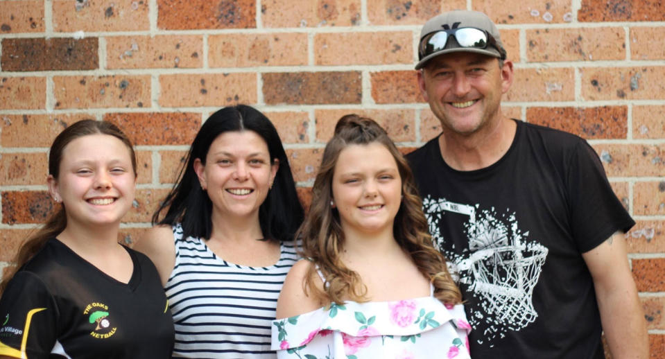 Darren and Gail Carter pictured with their daughters Nikki, 12, and Jamie, 11.