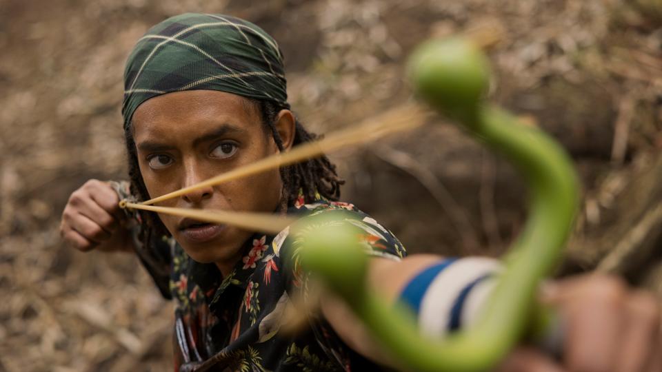 Jacob Romero Gibson drawing a slingshot as Usopp in One Piece