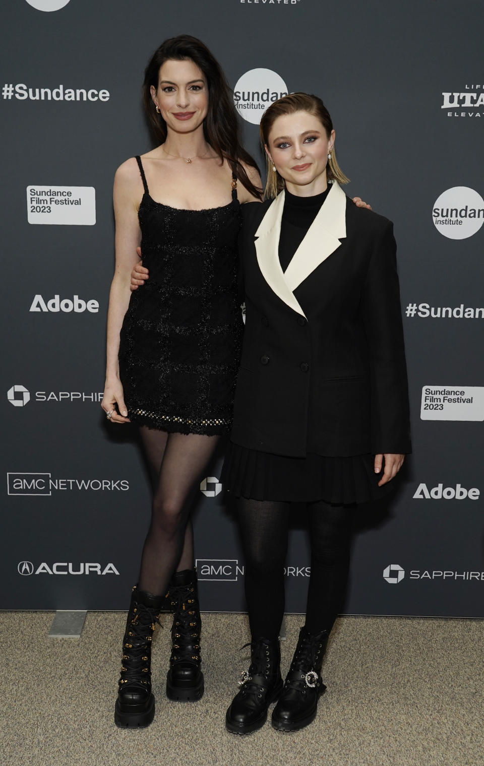 Anne Hathaway, left, and Thomasin McKenzie, cast members in "Eileen," pose together at the premiere of the film at the 2023 Sundance Film Festival, Saturday, Jan. 21, 2023, in Park City, Utah. (AP Photo/Chris Pizzello)