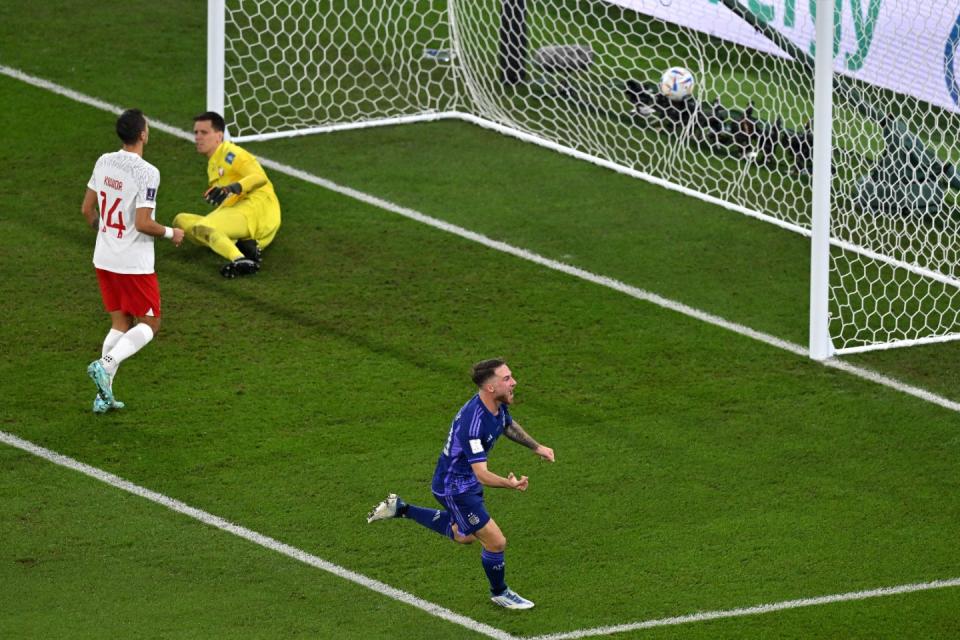 Argentina's midfielder #20 Alexis Mac Allister celebrates scoring his team's first goal during the Qatar 2022 World Cup Group C football match between Poland and Argentina at Stadium 974 in Doha on November 30, 2022. (Photo by GLYN KIRK/AFP via Getty Images)