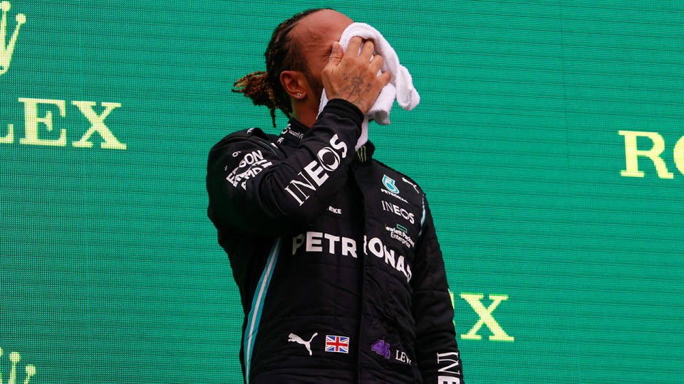 Lewis Hamilton, pictured here in distress on the podium after the Hungarian Grand Prix.