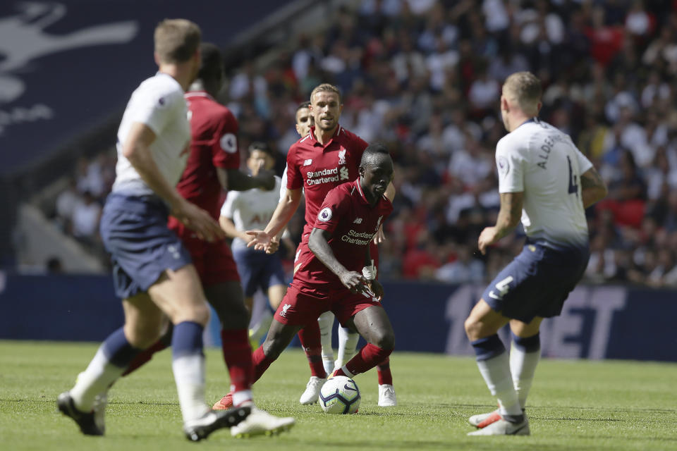 Liverpool's Sadio Mané, center, vies the ball during the English Premier League soccer match between Tottenham Hotspur and Liverpool at Wembley Stadium in London, Saturday Sept. 15, 2018. (AP Photo/Tim Ireland)