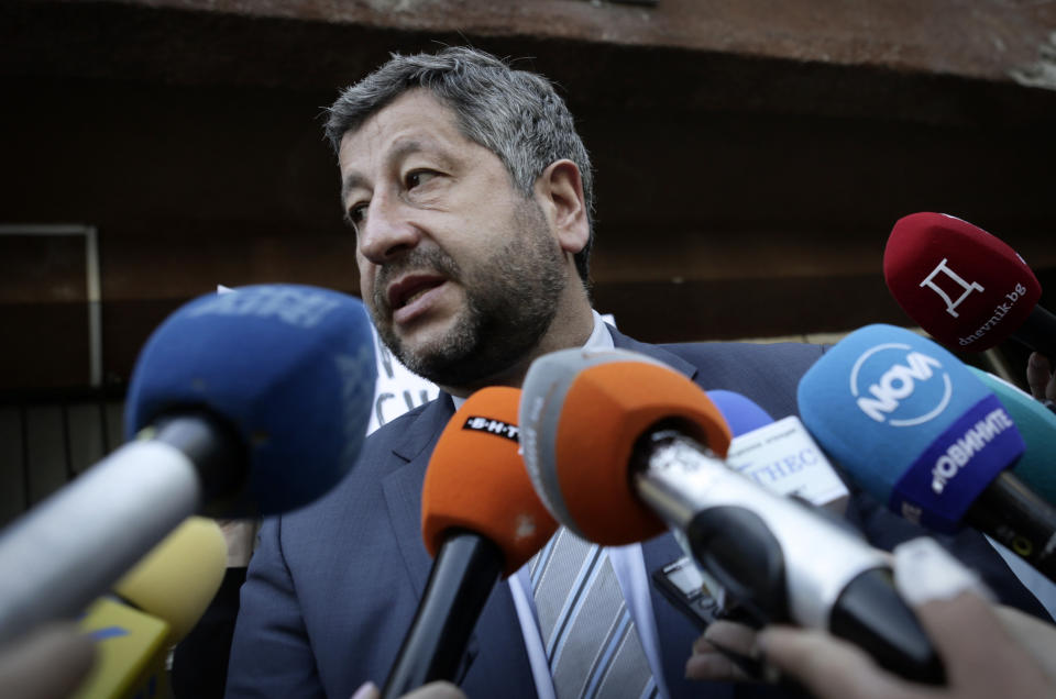 Hristo Ivanov, leader of the opposition Democratic Bulgarian party, speaks to journalists after casting his vote at a polling station in Sofia, Sunday, July 11, 2021. "Bulgaria needs to turn a new page. We need to move on from this situation of corruption," Ivanov said. (AP Photo/Valentina Petrova)