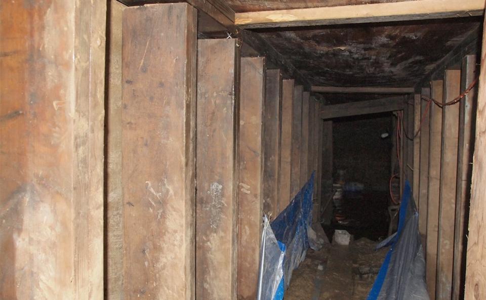 A 33-foot-long tunnel supported using lumber found in Toronto, Ontario is pictured in this handout photo provided by Toronto Police, February 24, 2015. Police in Toronto have discovered a tunnel with electricity supplied by a generator near one of the venues for this summer's Pan American Games, a spokesman said on Monday. REUTERS/Toronto Police/Handout (CANADA - Tags: CRIME LAW SPORT) FOR EDITORIAL USE ONLY. NOT FOR SALE FOR MARKETING OR ADVERTISING CAMPAIGNS. THIS IMAGE HAS BEEN SUPPLIED BY A THIRD PARTY. IT IS DISTRIBUTED, EXACTLY AS RECEIVED BY REUTERS, AS A SERVICE TO CLIENTS