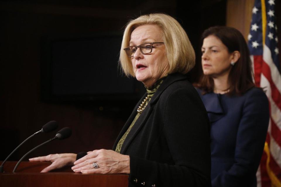 FILE - This March 6, 2014 file photo shows Sen. Claire McCaskill, D-Mo., left, and Sen. Kelly Ayotte, R-N.H. at a news conference on Capitol Hill in Washington. The Senate is heading toward a vote to change the military justice system to deal with sexual assault. The legislation would scrap the nearly century-old practice of an accused being able to use a "good soldier defense" to raise doubts that a crime had been committed. (AP Photo/Charles Dharapak, File)