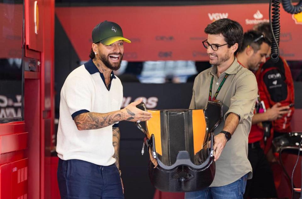 Colombian singer Maluma, left, and Carlos Oñoro Sainz are seen at the Ferrari garage before the start of the Formula One Miami Grand Prix at the Miami International Autodrome on Sunday, May 7, 2023, in Miami Gardens, Fla.