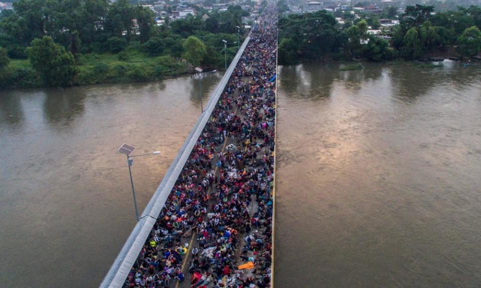 Aerial view of the Honduran migrant caravan on the Guatemala-Mexico international border bridge in Ciudad Hidalgo, Mexico.