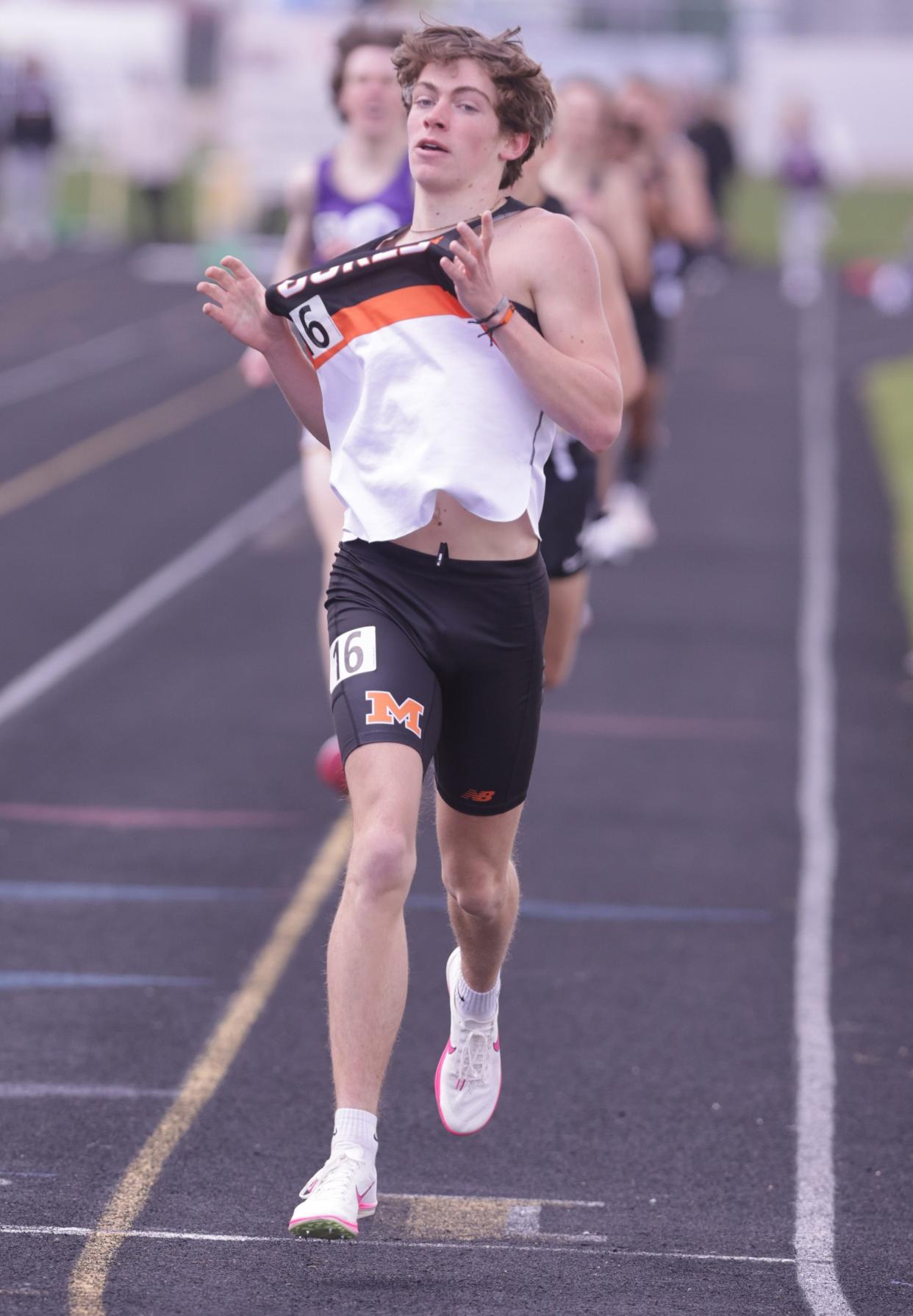 Marlington's Colin Cernansky wins the 1,600 meters at this year's Stark County Track and Field Championships.