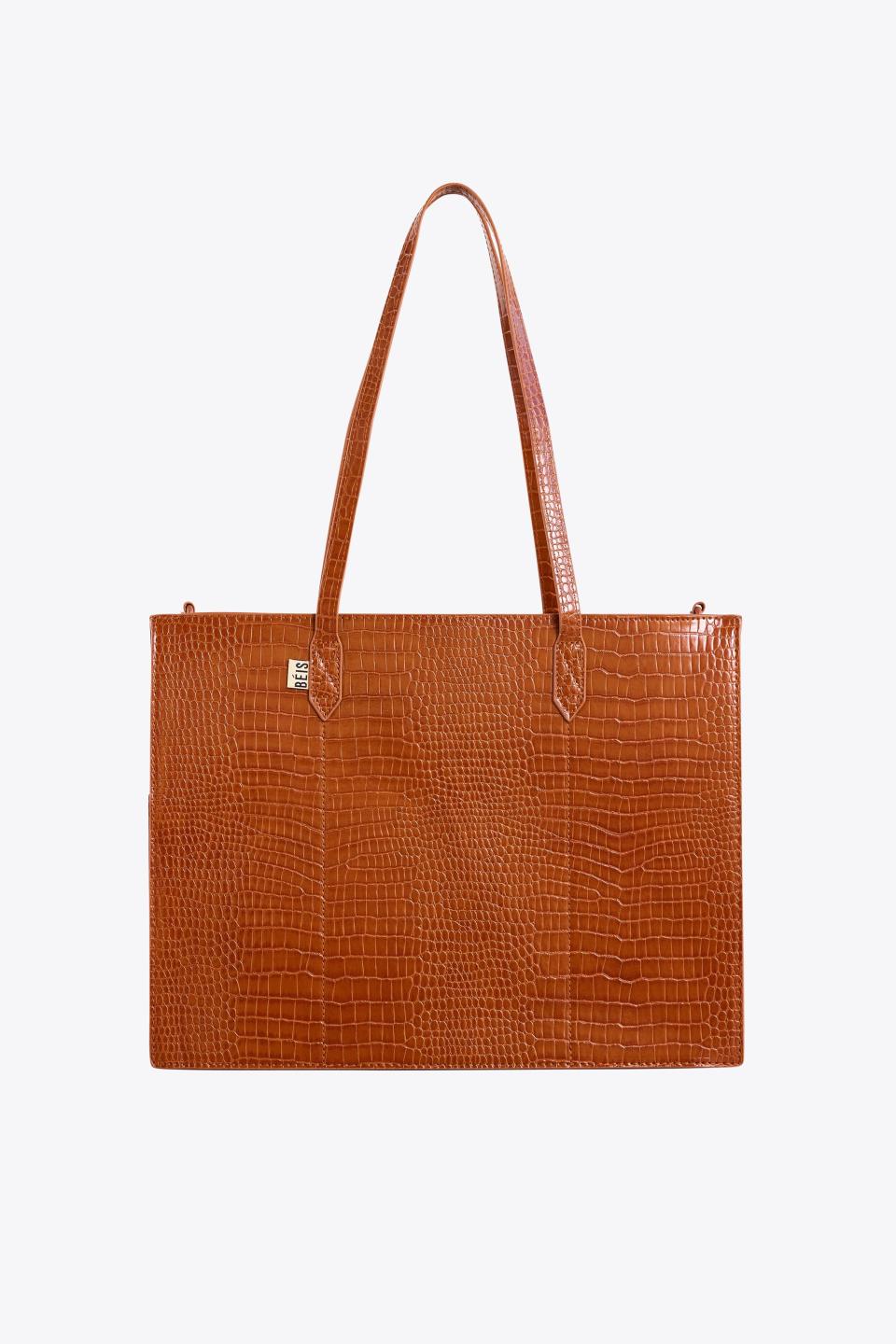 <p><a href="https://go.redirectingat.com?id=74968X1596630&url=https%3A%2F%2Fbeistravel.com%2Fproducts%2Fthe-work-tote-in-cognac-croc&sref=https%3A%2F%2Fwww.housebeautiful.com%2Fshopping%2Fhome-accessories%2Fg44496280%2Ftop-beis-travel-picks%2F" rel="nofollow noopener" target="_blank" data-ylk="slk:Shop Now;elm:context_link;itc:0;sec:content-canvas" class="link ">Shop Now</a></p><p>The Work Tote</p><p>$128.00</p><p>beistravel.com</p><span class="copyright">Beis</span>