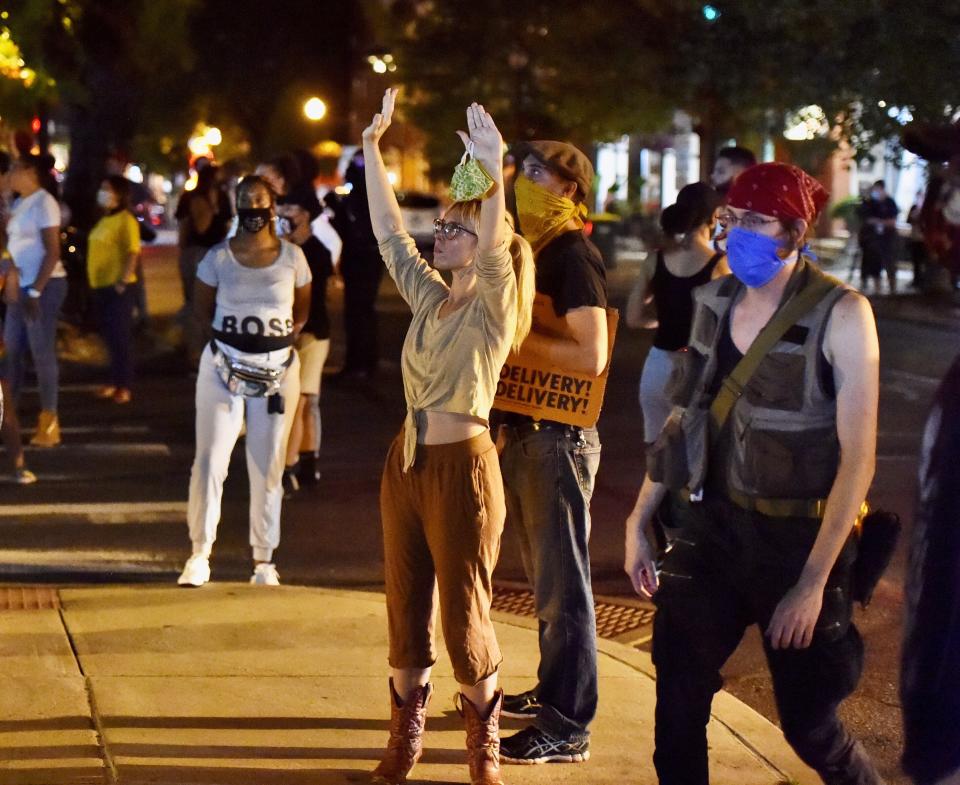 Black Lives Matter protesters block West Chestnut Street at North Prince Street near the Lancaster city police station on Sunday, Sept. 13, 2020. A man was shot by police earlier in the day after a reported domestic dispute, police said. A Lancaster city police officer fired at a 27-year-old man who was armed with a knife. The man, identified as Ricardo Munoz, was killed and pronounced dead at the scene. (Blaine Shahan, LNP/LancasterOnline via AP)