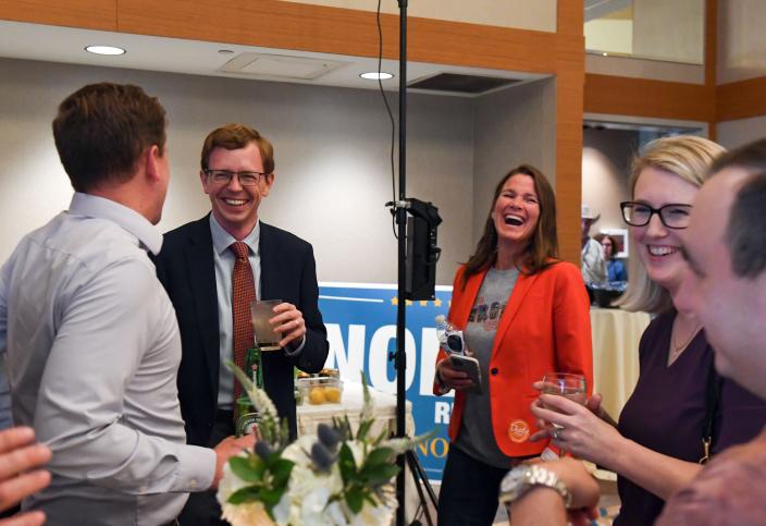 Representative Dusty Johnson smiles with attendees at an election night watch party on Tuesday, June 7, 2022, at the Hilton Garden Inn in Sioux Falls.