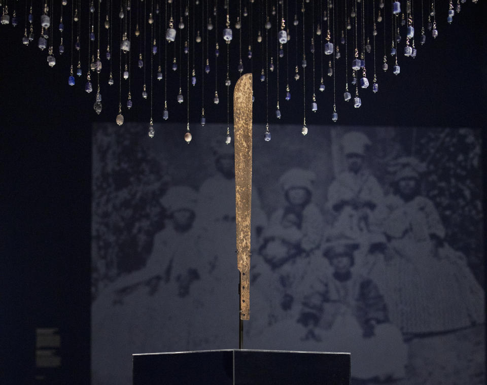 FILE - A machete used for cutting sugar cane is displayed at the Slavery exhibition Rijksmuseum in Amsterdam, Netherlands in this May 17, 2021 file photo. Netherlands is expected to issue a rare apology for its brutal slavery past, possibly becoming one of the few countries in the world to do so. But before Dutch officials even set foot in their former Caribbean colonies next week, activists and officials already have taken offense about not being asked for input and have complained about the timing of the potential moment of reckoning. (AP Photo/Peter Dejong, File)