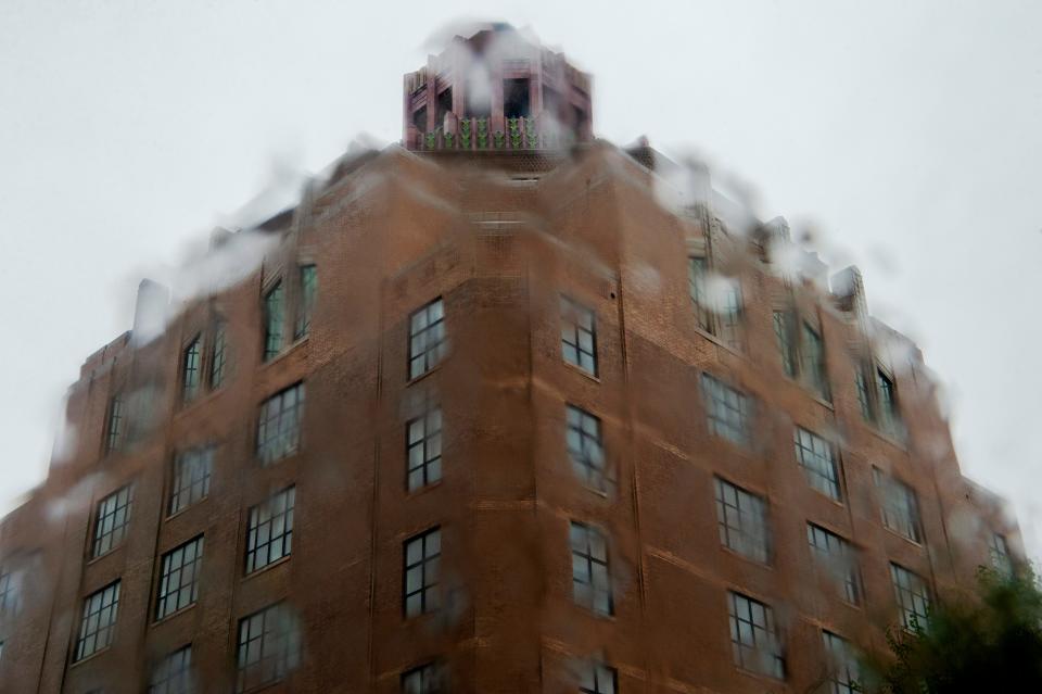 Rain falls on City Hall in Asheville, April 7, 2023.