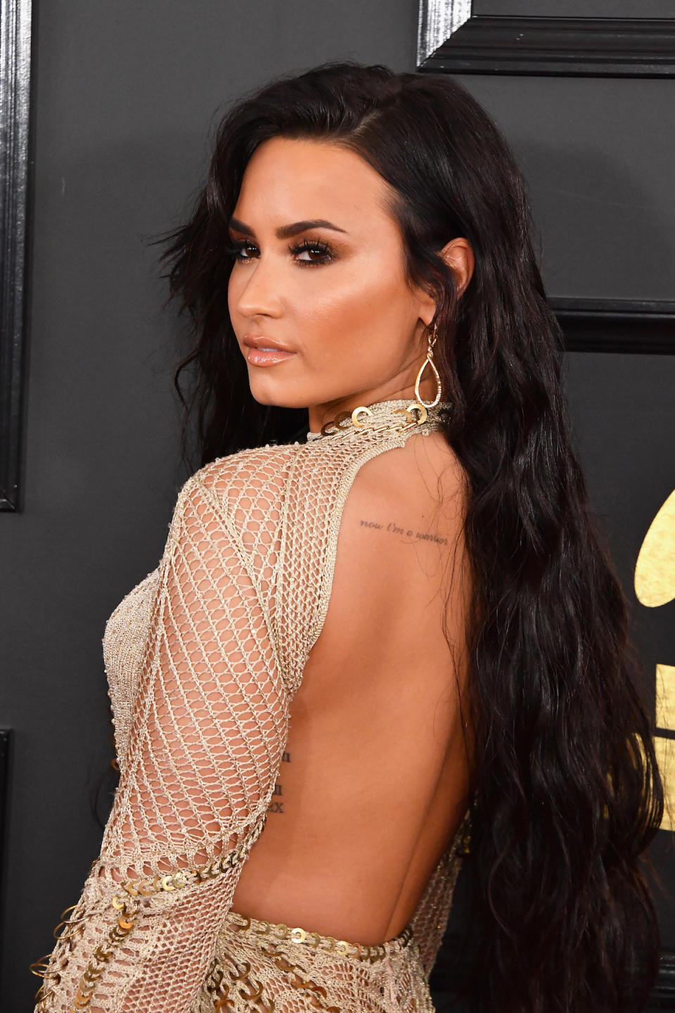 <p>In a backless dress, Demi gave a peek at some of her subtlest ink. (Photo: Getty Images) </p>