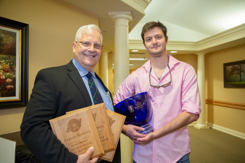 Asgard Brewing Founder and CEO Stephen Porter, right, and Founder John K. Porter, left, pose at The Best of Maury Banquet held at Life Care Center of Columbia on Thursday, Aug. 23, 2018.