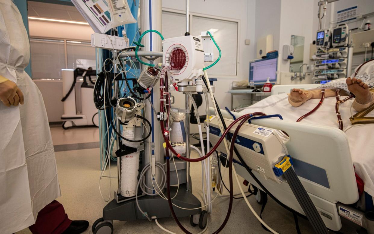A Covid-19 patient at the Royal Brompton Hospital AICU in London receiving ECMO (Extracorporeal Membrane Oxygenation) treatment - Simon Townsley 