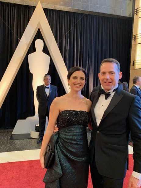 Cathy in a Mikael Aghal dress, with Johnnie, at the Oscars 2019