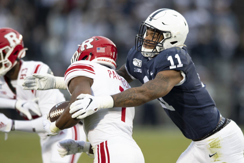 FILE - In this Nov. 30, 2019, file photo, Penn State linebacker Micah Parsons (11) tackles Rutgers tight end Johnathan Lewis (11) in the first quarter of an NCAA college football game, in State College, Pa. Parsons was selected to The Associated Press All-America team, Monday, Dec. 16, 2019. (AP Photo/Barry Reeger)