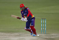 Karachi Kings' Mohammad Nabi plays a shot during a Pakistan Super League T20 cricket match between Karachi Kings and Lahore Qalandars at the National Stadium, in Karachi, Pakistan, Sunday, Feb. 28, 2021. (AP Photo/Fareed Khan)