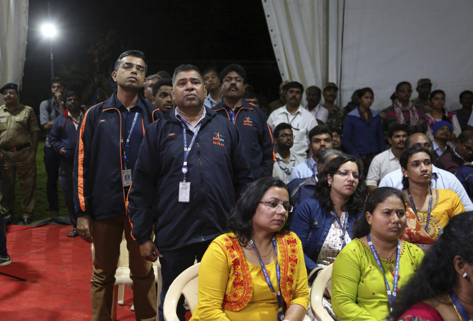 Indian Space Research Organization (ISRO) employees react as they listen to an announcement by organizations's chief Kailasavadivoo Sivan at its Telemetry, Tracking and Command Network facility in Bangalore, India, Saturday, Sept. 7, 2019. India's space agency said it lost touch Saturday with its Vikram lunar lander as it aimed to land on the south pole of the moon and deploy a rover to search for signs of water. (AP Photo/Aijaz Rahi)