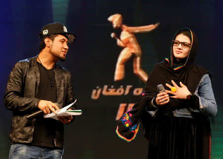 Zulala Hashimi, 18 (R) and Sayed Jamal Mubarez, 23 (L) singer finalists of the music contest 'Afghan Star', rehearse for the show in Kabul, Afghanistan March 19, 2017. REUTERS/Mohammad Ismail