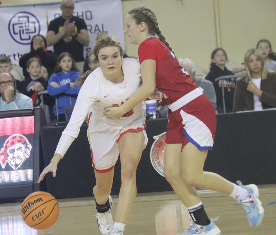 Dale's Faith Wright (left) dribbles the ball against the pressure of a Silo defender Thursday morning in the opening round of the Class 2A Girls State Basketball Tournament in Oklahoma City.