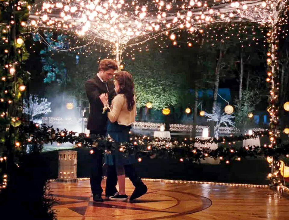 <p>Kristen Stewart and Robert Pattinson remind us what true love is during their private dance outside the prom. We love that, despite having a broken leg and being the typical tomboy, Bella wears a dress, albeit with a sneaker on her other foot. (Photo: Summit Entertainment) </p>