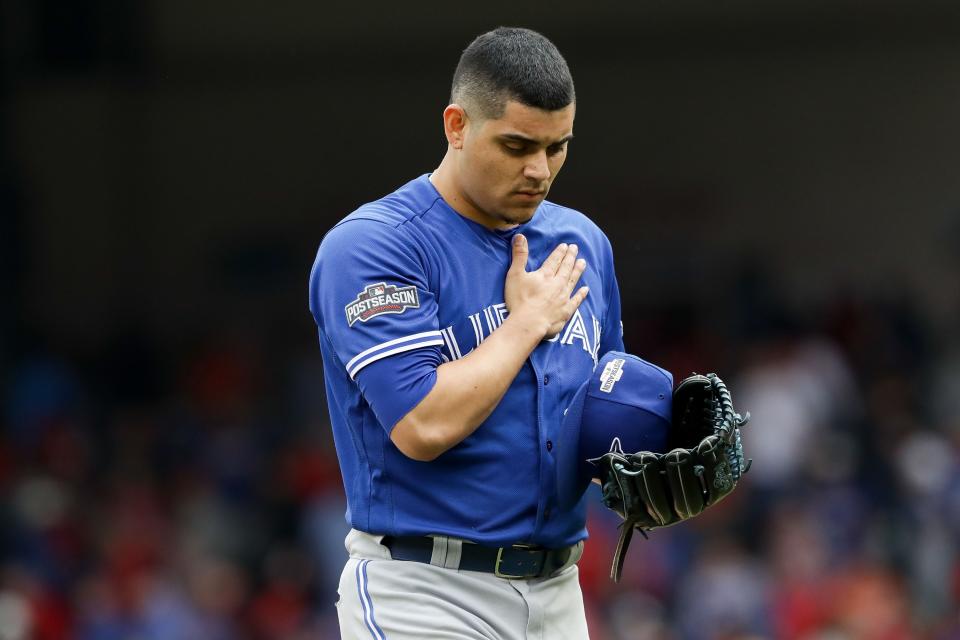 ARLINGTON, TX - OCTOBER 07: Roberto Osuna #54 of the Toronto Blue Jays reacts against the Texas Rangers in game two of the American League Divison Series at Globe Life Park in Arlington on October 7, 2016 in Arlington, Texas. (Photo by Ronald Martinez/Getty Images)