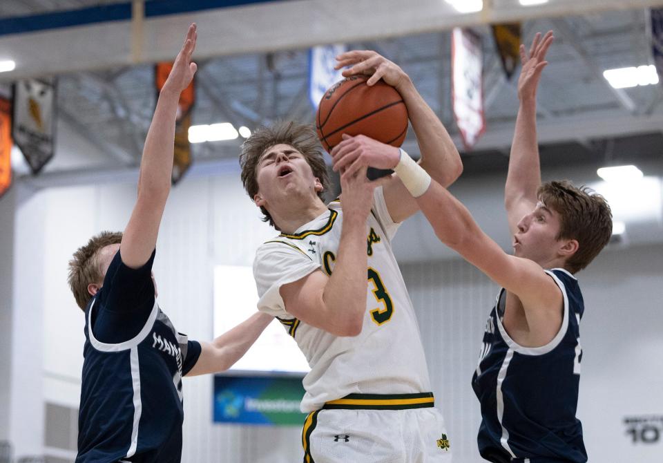RBC CJ Ruoff tries to shoot but gets blocked in first half action. Manasquan vs Red Bank Catholic Boys Basketball in Shore Conference Tournament Semifinals in Toms River NJ on February 24, 2022. 