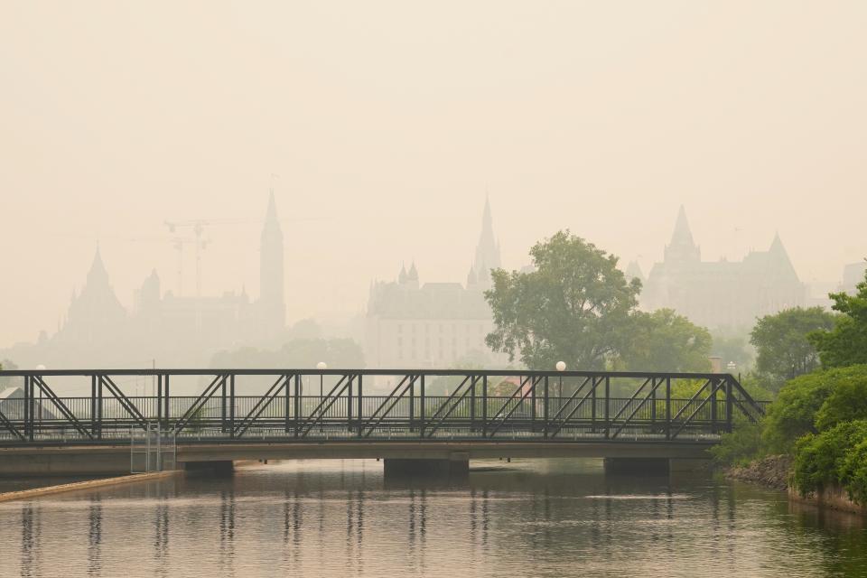 Smoke hangs over Ottawa, Canada’s capital city (Sean Kilpatrick/The Canadian Press via AP)