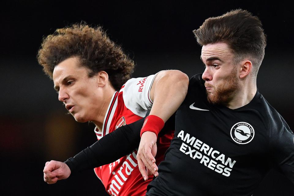 Arsenal's Brazilian defender David Luiz (L) vies with Brighton's Irish striker Aaron Connolly during the English Premier League football match between Arsenal and Brighton and Hove Albion at the Emirates Stadium in London on December 5, 2019. (Photo by Ben STANSALL / AFP) / RESTRICTED TO EDITORIAL USE. No use with unauthorized audio, video, data, fixture lists, club/league logos or 'live' services. Online in-match use limited to 120 images. An additional 40 images may be used in extra time. No video emulation. Social media in-match use limited to 120 images. An additional 40 images may be used in extra time. No use in betting publications, games or single club/league/player publications. /  (Photo by BEN STANSALL/AFP via Getty Images)