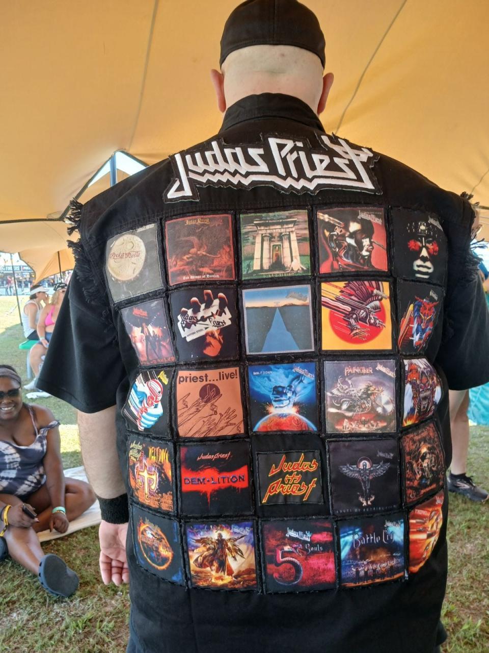 Dozens of band patches sewn on the front and back of Jimm Colarusso's Judas Priest jacket at Welcome to Rockville, Thursday, May 9, 2024.