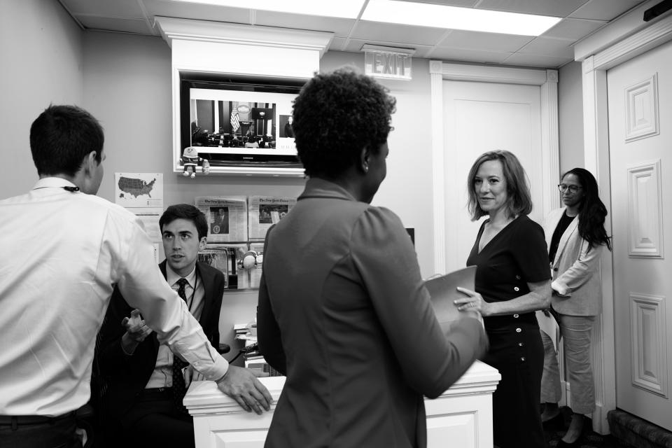 Office Life
With colleagues including press assistant Michael Kikukawa (second from left) and Amanda Finney, the chief of staff for the press office and special assistant to the press secretary (far right).