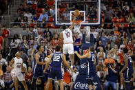 Auburn forward Jabari Smith (10) goes high to slam down two points during the first half of an NCAA college basketball game against Yale, Saturday, Dec. 4, 2021, in Auburn, Ala. (AP Photo/Vasha Hunt)