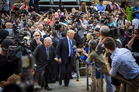 U.S. Republican presidential candidate Donald Trump (C) arrives for jury duty at Manhattan Supreme Court in New York August 17, 2015. REUTERS/Lucas Jackson