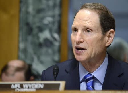 Senate Finance Committee Chairman Ron Wyden (D-OR), who is attending his first hearing as chairman after the retirement of Sen. Max Baucus (D-MT) makes opening remarks as on hearings on President Obama's Fiscal Year 2015 Budget, on Capitol Hill, in Washington, March 5, 2014. REUTERS/Mike Theiler