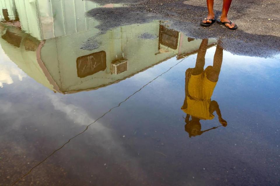 Samantha Destin, 8, at Miami Soar, which experiences flooding when it rains. Many of the kids in the trailer park are friends and get together after school to play together.