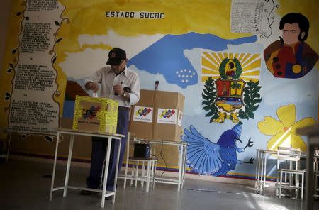 A man votes in a polling center in Caracas, June 28, 2015. REUTERS/Jorge Dan Lopez