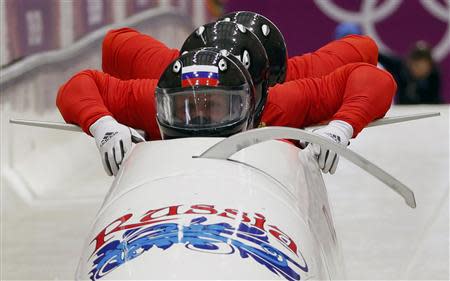 Russia's pilot Alexander Zubkov (front) and his teammates start during a four-man bobsleigh training event at the Sanki Sliding Center in Rosa Khutor, during the Sochi 2014 Winter Olympics February 19, 2014. REUTERS/Alister Doyle