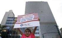 A young girl holds a placard protesting against U.S. President Donald Trump's immigration policies in New York City, U.S., June 26, 2018. REUTERS/Brendan Mcdermid