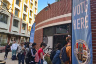 Voters wait on line at a polling station at the University of Southern California on Tuesday, March 3, 2020. Some California voters are waiting in long lines because of technical glitches connecting to the statewide voter database or too many users trying to cast ballots at once. The secretary of state's office said election workers in 15 counties could not connect to the statewide voter registration database on Super Tuesday but that the issues have been resolved. (AP Photo/Stefanie Dazio)