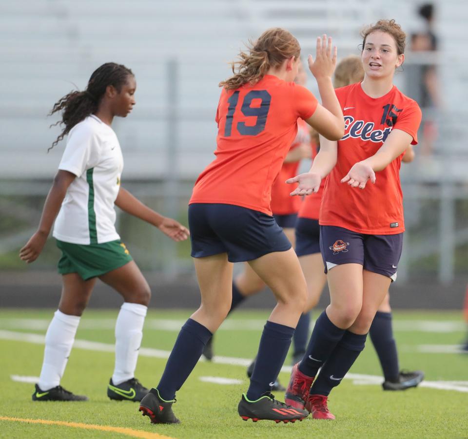 Ellet's Reese Tucker, right, is congratulated by Alivia Russell after scoring a first half goal against Firestone on Wednesday, Sept. 21, 2022 in Akron.