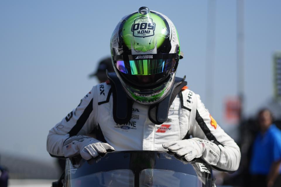 Nolan Siegel climbs into his car during a practice session for the Indianapolis 500 auto race at Indianapolis Motor Speedway, Thursday, May 16, 2024, in Indianapolis. (AP Photo/Darron Cummings)