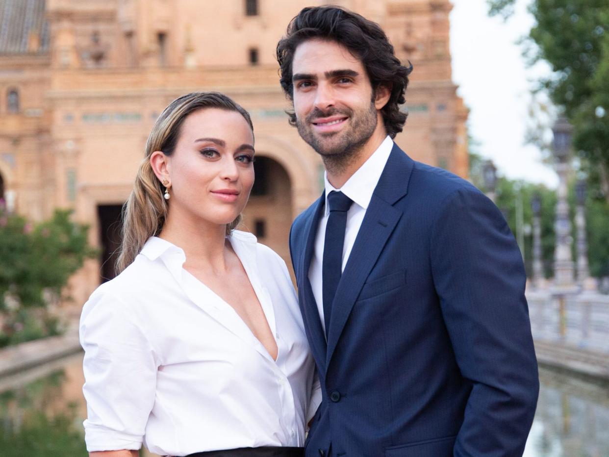 Paula Badosa and Juan Betancourt is seen at the front row ahead of "Crucero" collection fashion show organized by Dior at Plaza de España on June 16, 2022 in Seville, Spain.