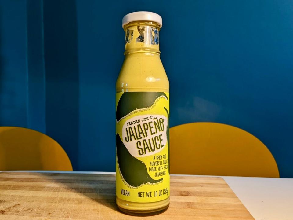 bottle of trader joe's jalapeno sauce on a kitchen table