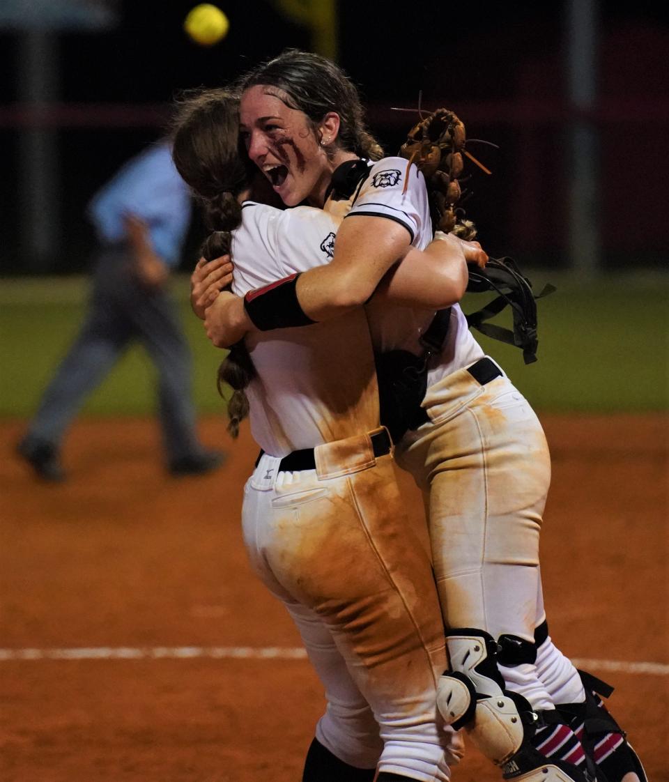 South Fork catcher Abbey Moore is hugged by pitcher Katie Kidwell after the Bulldogs defeated Pembroke Pines Charter 8-3 in the Region 4-5A championship game on Friday, May 19, 2023 in Stuart.