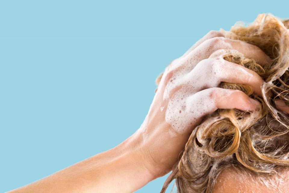pre-poo: woman shampooing hair